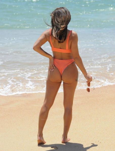 Kayleigh Morris – In orange bikini on the beach in Cyprus