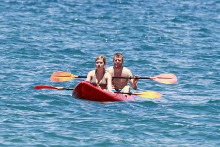 Jennette McCurdy wearing a pretty bikini and board shorts was spotted kayaking with a male friend in Maui