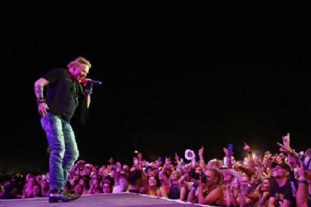 INDIO, CALIFORNIA - APRIL 30: Axl Rose of Guns N' Roses performs onstage with Carrie Underwood during Day 2 of the 2022 Stagecoach Festival at the Empire Polo Field