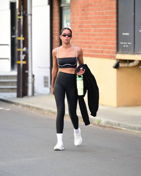 Laura Harrier shows off her fit physique in a tiny sports bra and