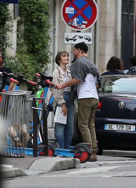Lily Collins – With new boyfriend Charlie McDowell go for a ride in scooter in Paris