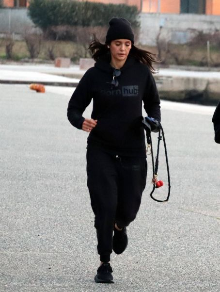 Nina Dobrev – Jogging with a friend at the promenade of Thessaloniki in Greece