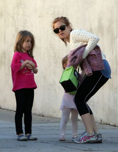 Isla Fisher shows off her trim body in leggings and leather as she treats  her little girl Elula to lunch