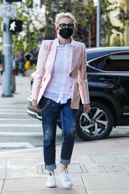 Sharon Stone – Dons a pink blazer and matching pink purse at Toscana