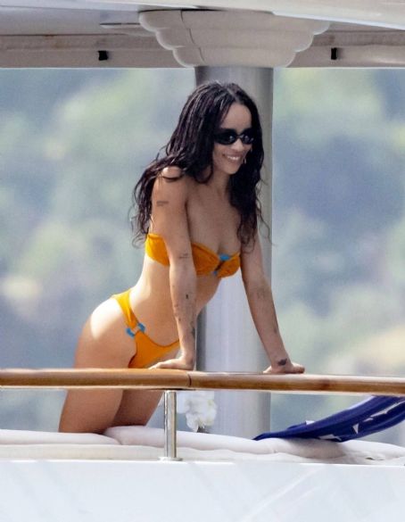 Zoe Kravitz – Spotted in orange bikini aboard a yacht in Positano – Italy