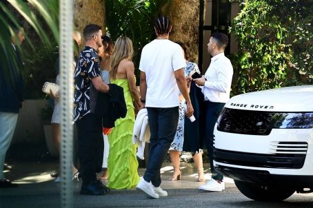 Nina Dobrev – Wearing yellow dress at Ben Bruno’s rehearsal dinner in West Hollywood