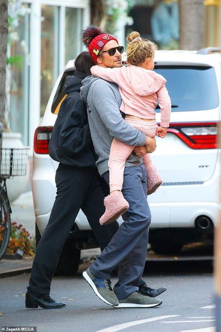 PICTURE EXCLUSIVE: Irina Shayk links arms with Bradley Cooper as pair dote on daughter Lea en-route to family Thanksgiving - amid rumors pair have rekindled their romance