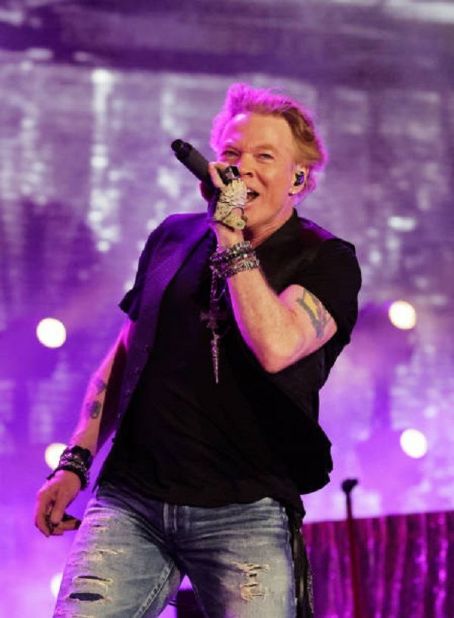 INDIO, CALIFORNIA - APRIL 30: Axl Rose of Guns N' Roses performs onstage with Carrie Underwood during Day 2 of the 2022 Stagecoach Festival at the Empire Polo Field