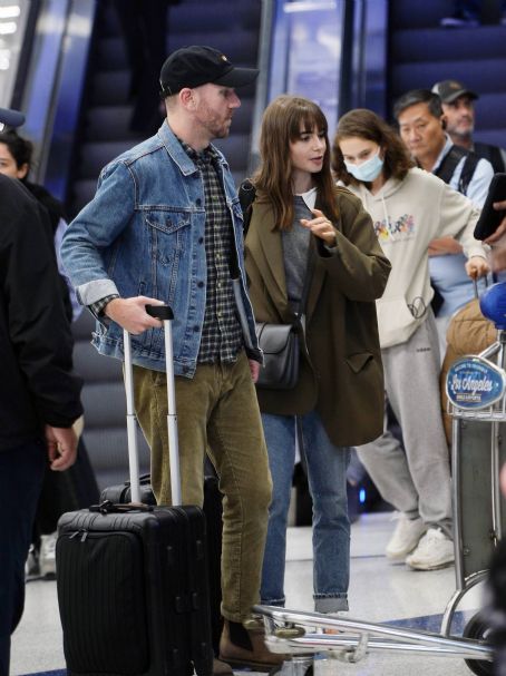Lily Collins – Arriving in Los Angeles