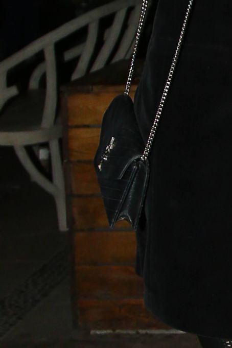 Arielle Kebbel – Out in black overcoat and YSL bag in New York