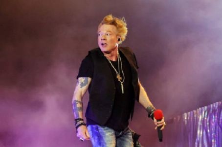 INDIO, CALIFORNIA - APRIL 30: Axl Rose of Guns N' Roses performs onstage with Carrie Underwood during Day 2 of the 2022 Stagecoach Festival at the Empire Polo Field