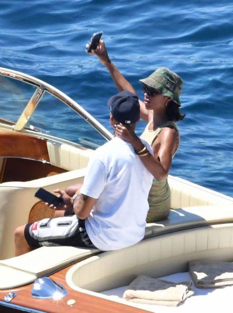 Laura Harrier – In a bikini on a boat with new beau Sam Jarou in Positano