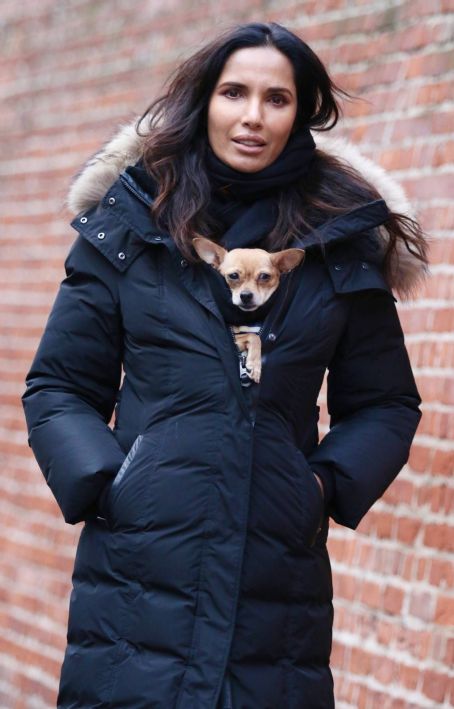 Padma Lakshmi – With her dog Divina warm inside her puffer jacket in New York