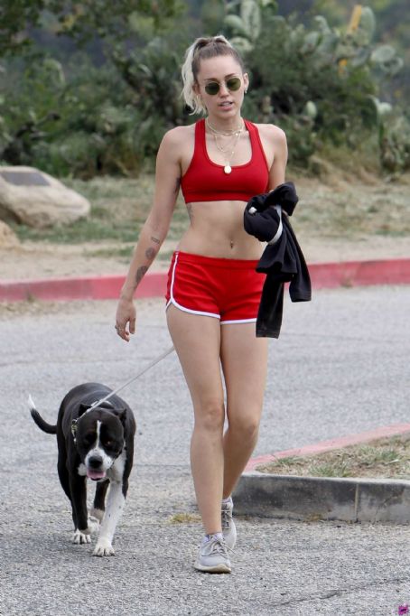 Miley Cyrus in Red Shorts and Sports Bra hiking in LA