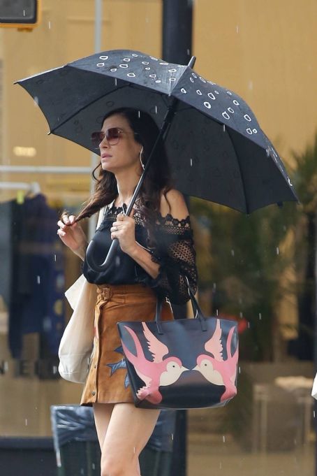 Famke Janssen – In a brown skirt in NY