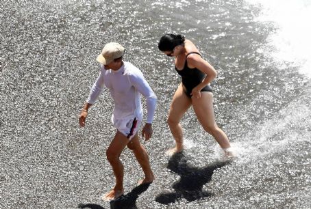 Katy Perry – Spotted in a black swimsuit while on vacation on Positano