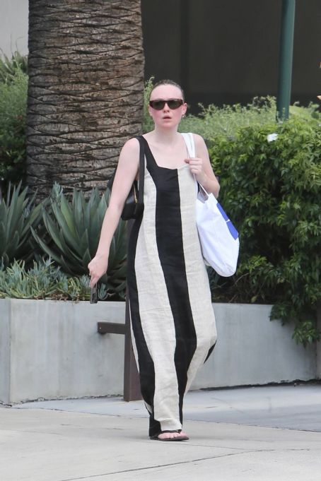 Dakota Fanning – Wearing bold stripe dress on Melrose in West Hollywood