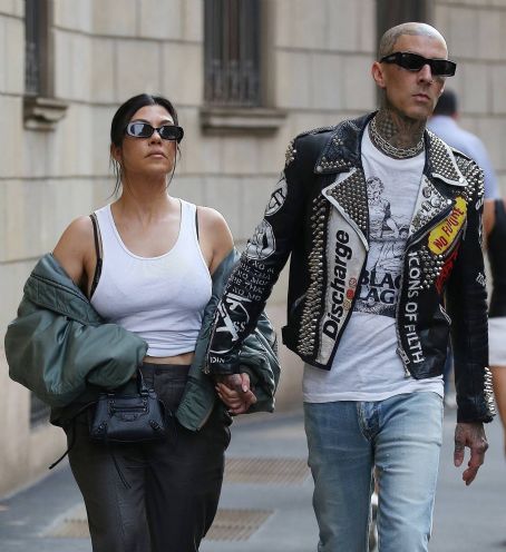 Kourtney Kardashian – With husband Travis Barker holding hands while out in Milan