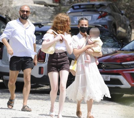 Alicia Vikander cradles a baby during holiday with husband Michael  Fassbender in Ibiza