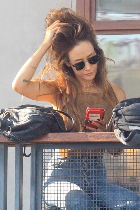 Maggie Q – Plays with her hair while at lunch in Hollywood
