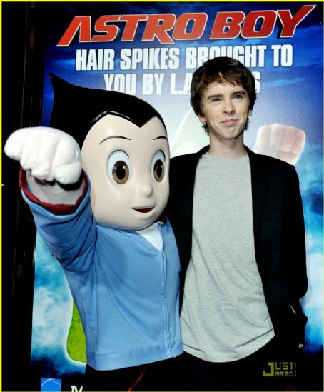 LOS ANGELES, CA. October 19, 2009: Freddie Highmore with Astro Boy  character at the Los Angeles