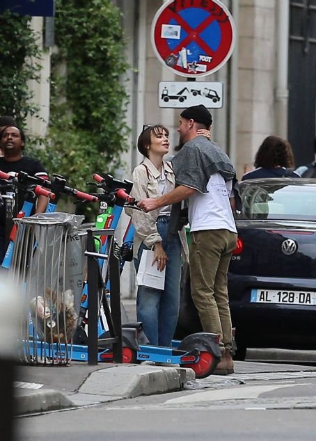 Lily Collins – With new boyfriend Charlie McDowell go for a ride in scooter in Paris